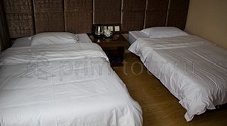 2-ух местная кровать в номере гостиницы Цзихао в г. Хуньчунь