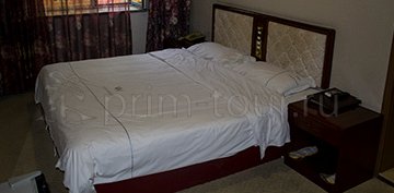 2-ух местная кровать в номере гостиницы Уди в г. Хуньчунь
